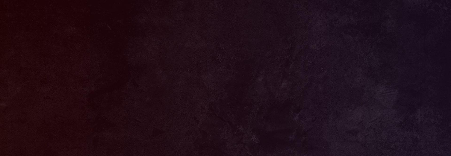 Dark maroon abstract background pattern.