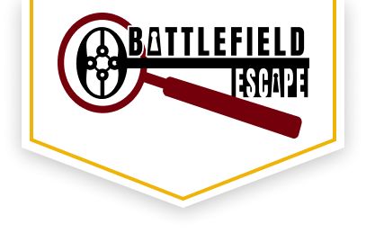 Battlefield Escape Logo.  A key and magnifying glass  with keyholes in the As.